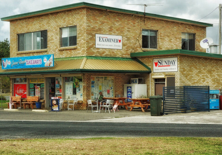 Brick corner shop with takeaway and outdoor seating